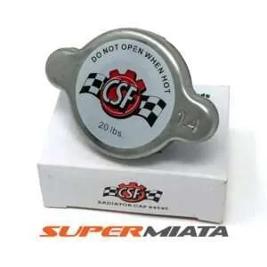CSF radiator cap on white background with packaging.
