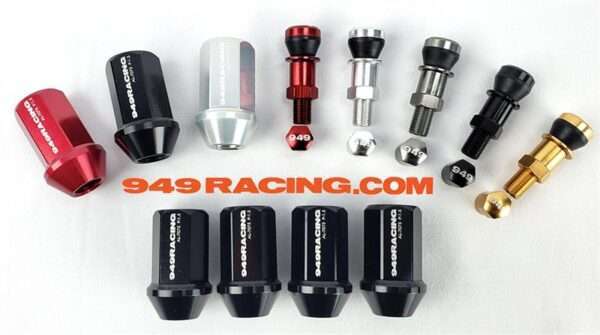 Assorted racing car lug nuts and wheel spacers.