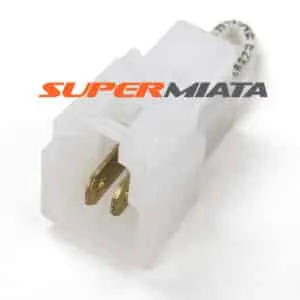 White electrical plug connector with logo.