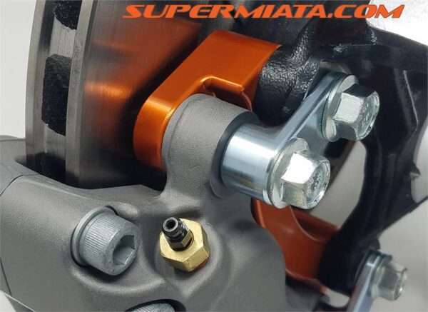 High-performance car brake caliper close-up.