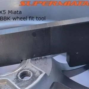 MX5 Miata wheel fitment tool on brake disc.