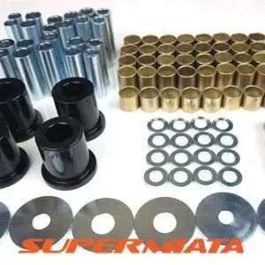 Assorted suspension bushing kit components on white background.