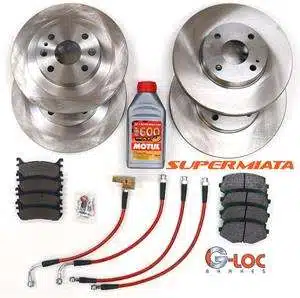 Car brake kit with rotors, pads, and fluid.