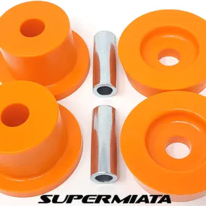 Orange car suspension bushings with metal sleeves.
