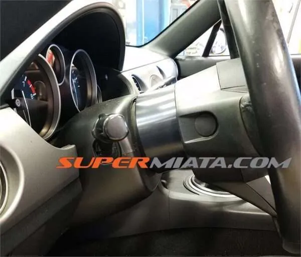 Car steering wheel and gauge cluster view.