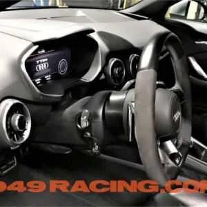 Audi car dashboard and steering wheel.