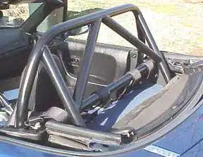Blue convertible car with roll cage.
