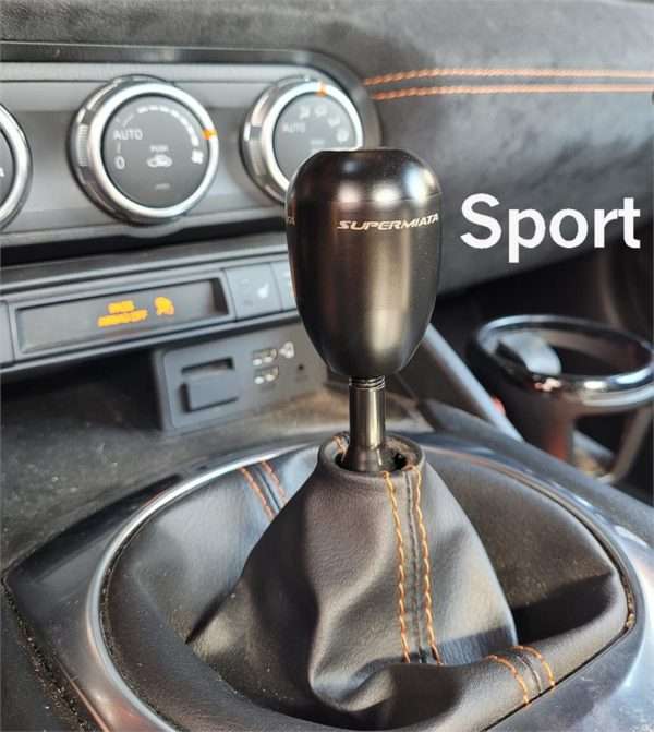 Manual car gear stick and dashboard.