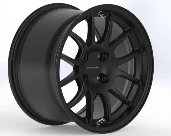 Black alloy car wheel on white background.