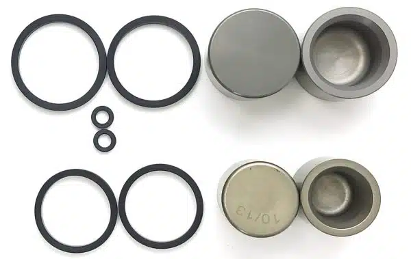 Assorted mechanical seals and gaskets on white.