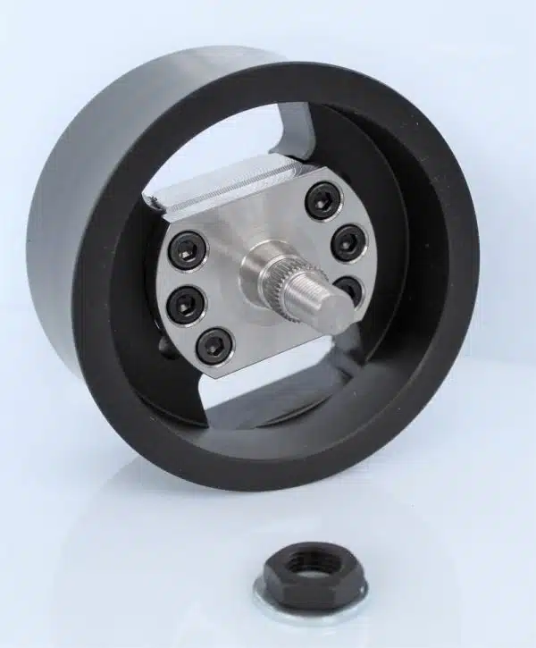 Precision black pulley with bearings on white background.