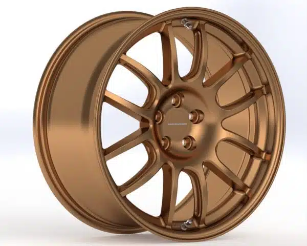 Bronze alloy car wheel on white background.